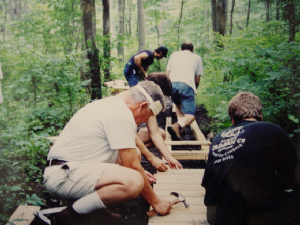 Volunteers creating a bridge